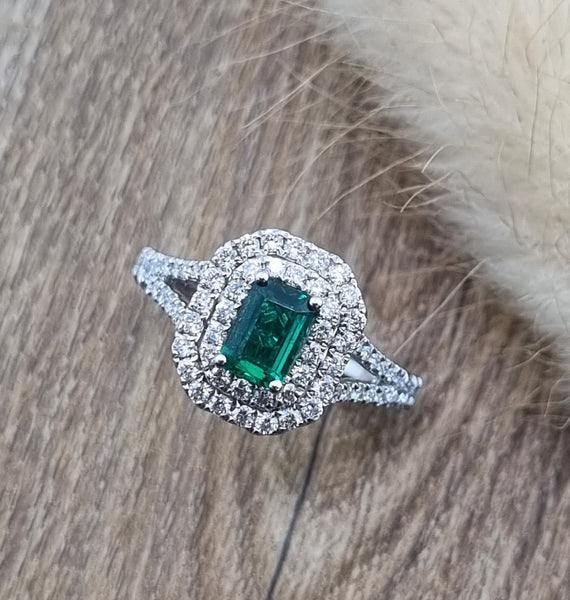 Emerald cut emerald double halo ring