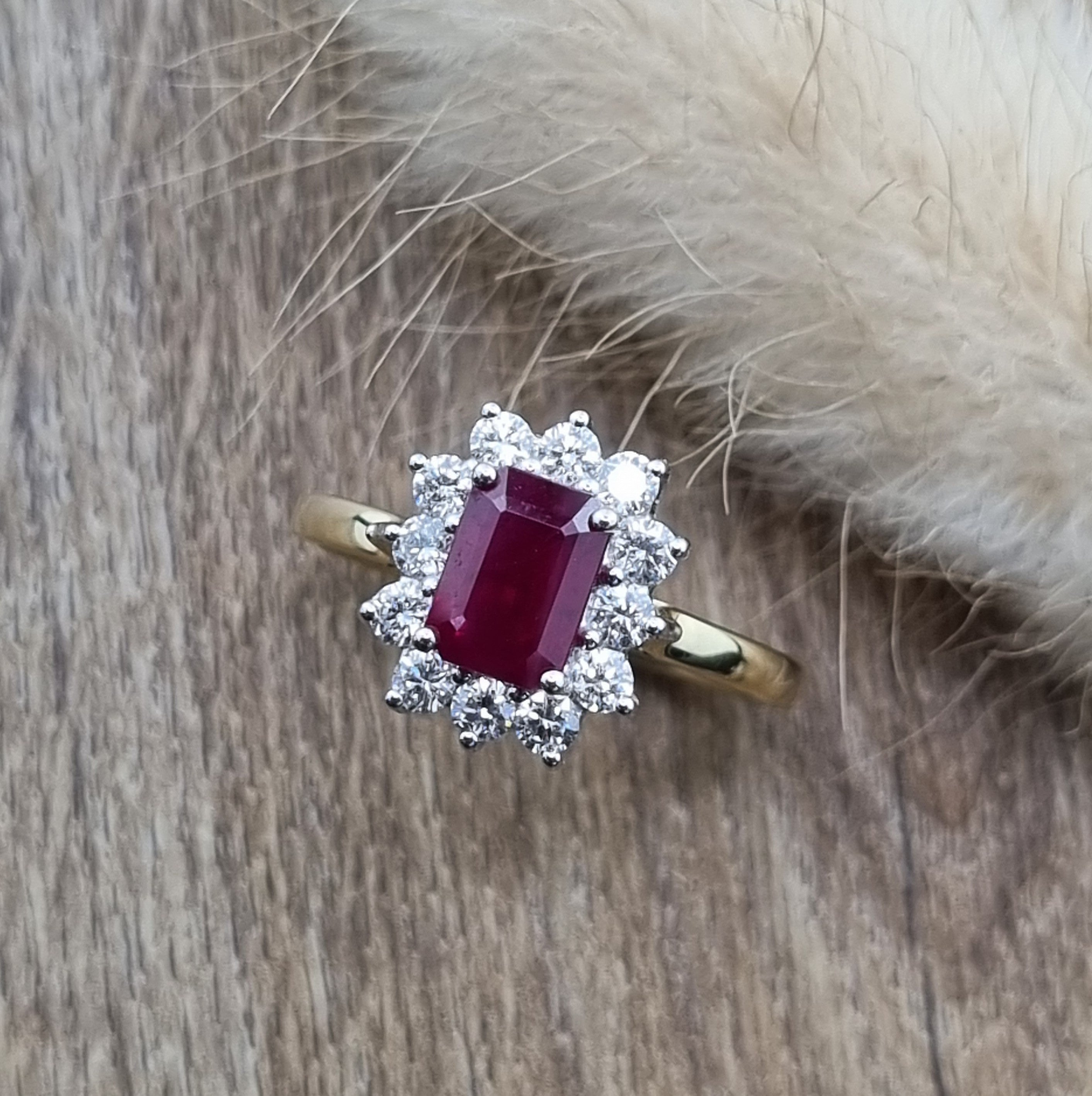 Emerald cut ruby and diamond cluster ring