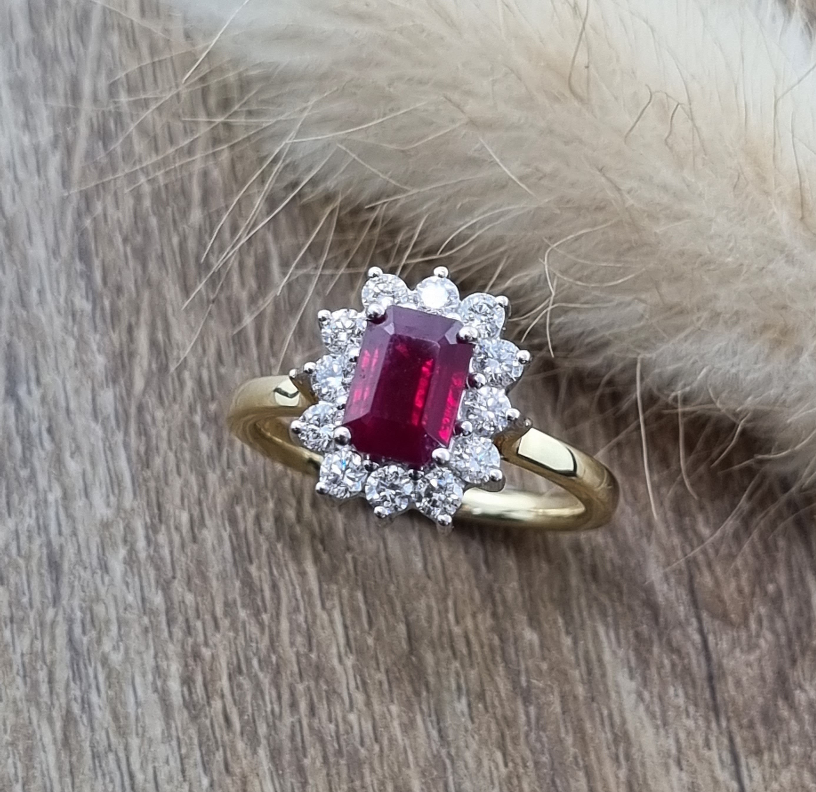 Emerald cut ruby and diamond cluster ring
