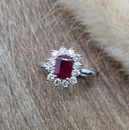 Emerald cut ruby and diamond cluster ring