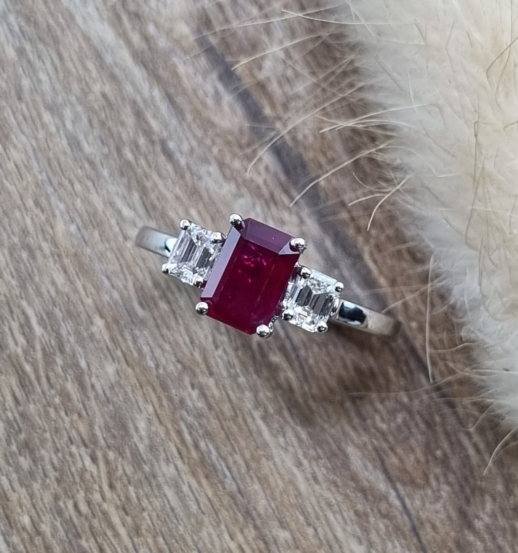 Emerald cut ruby and diamond trilogy ring
