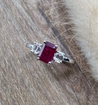 Emerald cut ruby and diamond trilogy ring