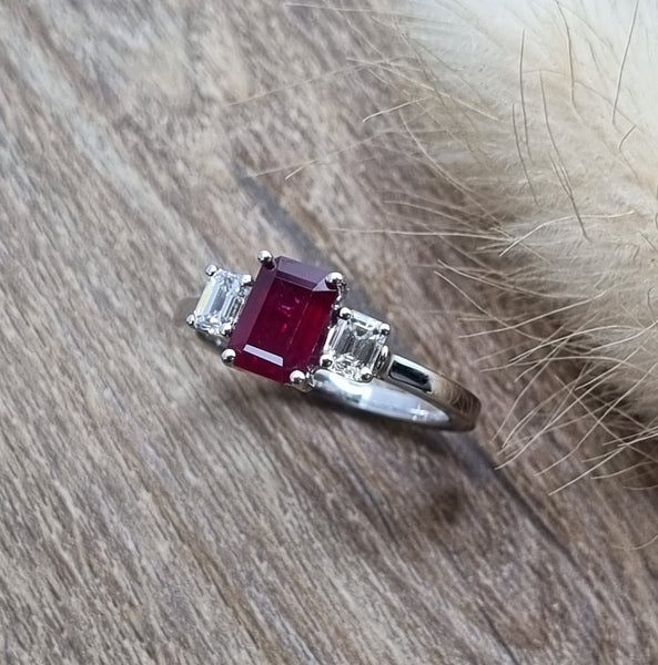 Emerald cut ruby and diamond trilogy ring