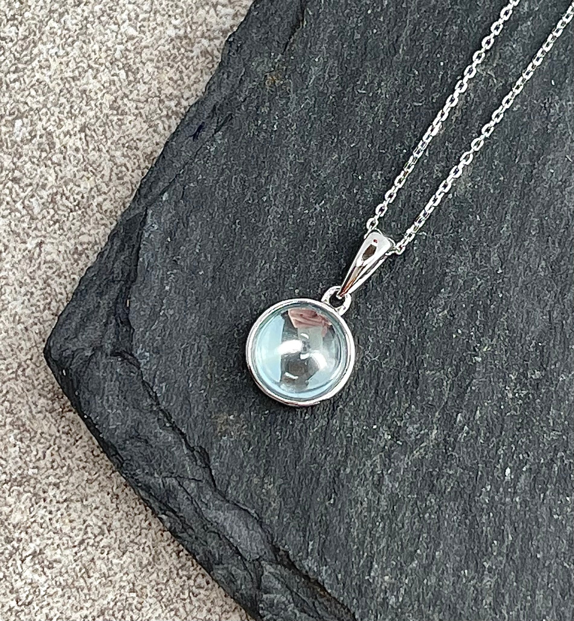 Round blue topaz pendant