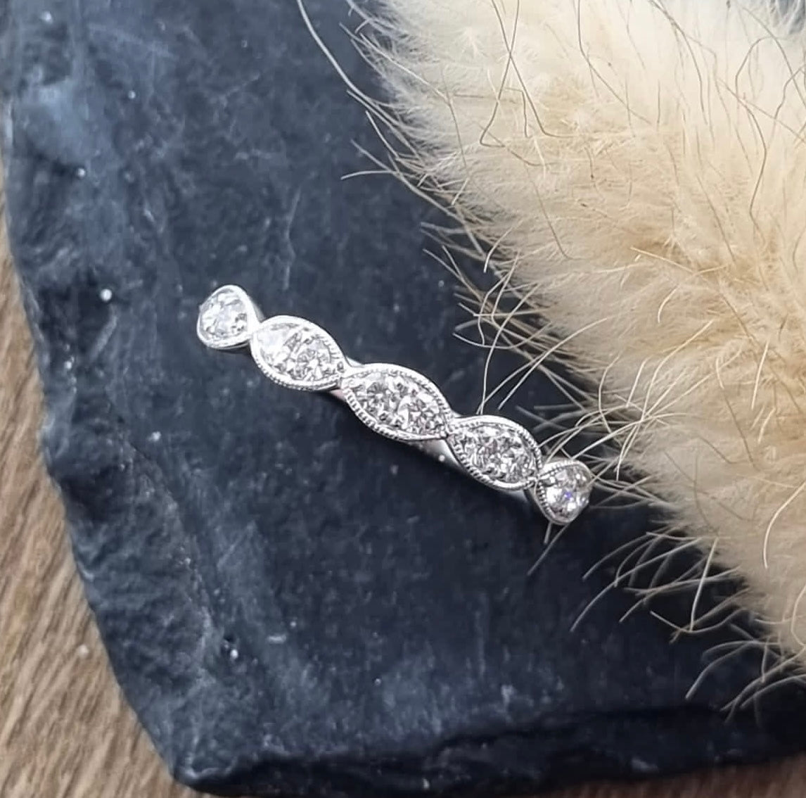 Scalloped pave set diamond band