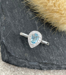 Pear shaped halo aquamarine ring