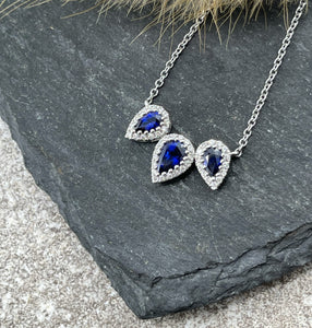 Sapphire and diamond triple halo pendant