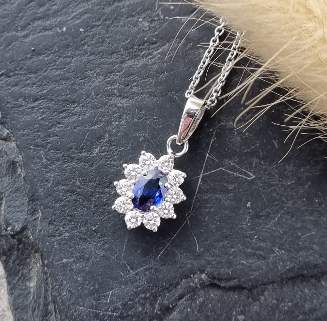 Sapphire and diamond oval cluster pendant
