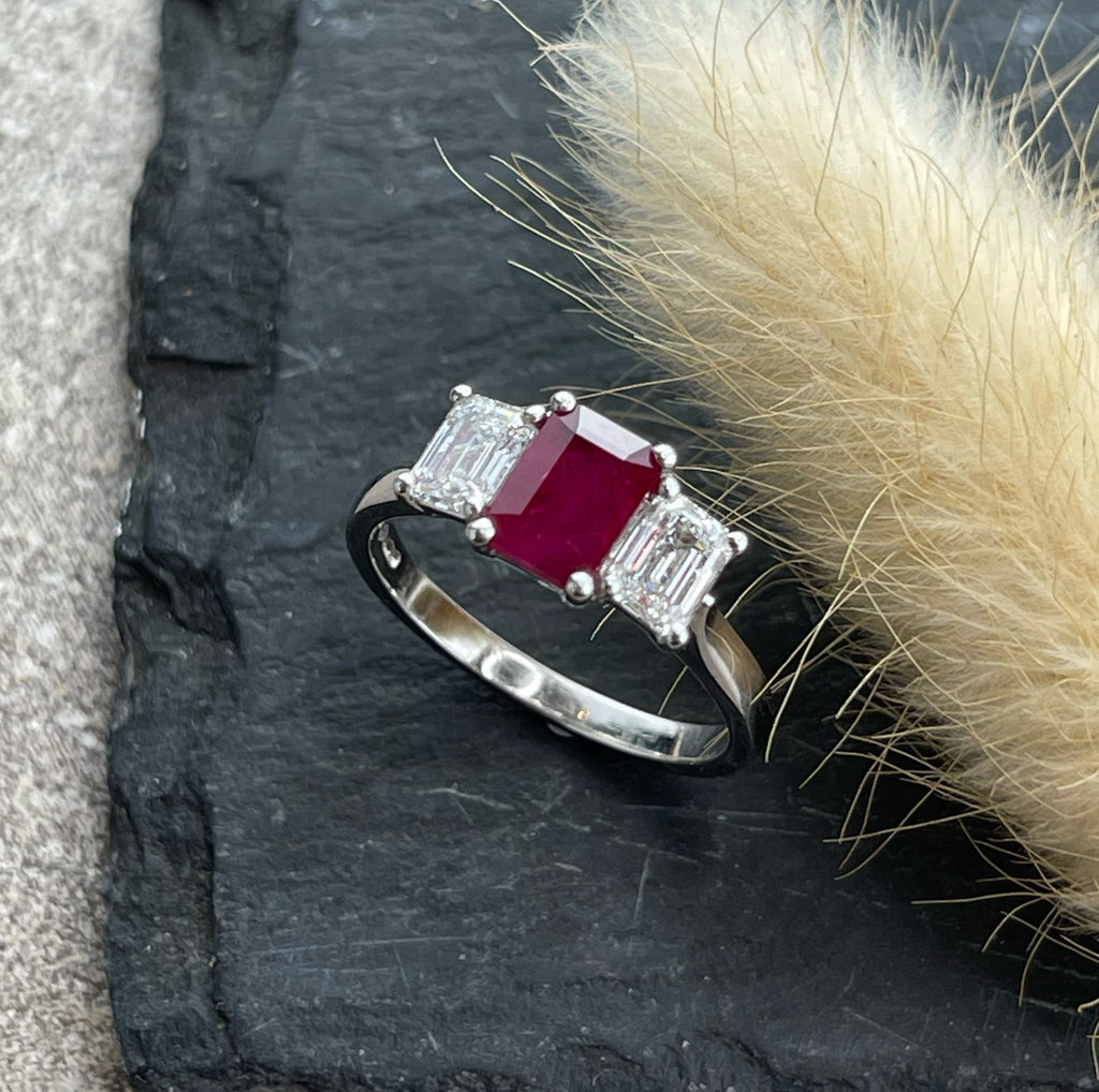 Emerald cut ruby and diamond trilogy ring