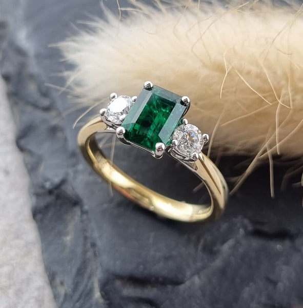 Emerald cut emerald trilogy ring