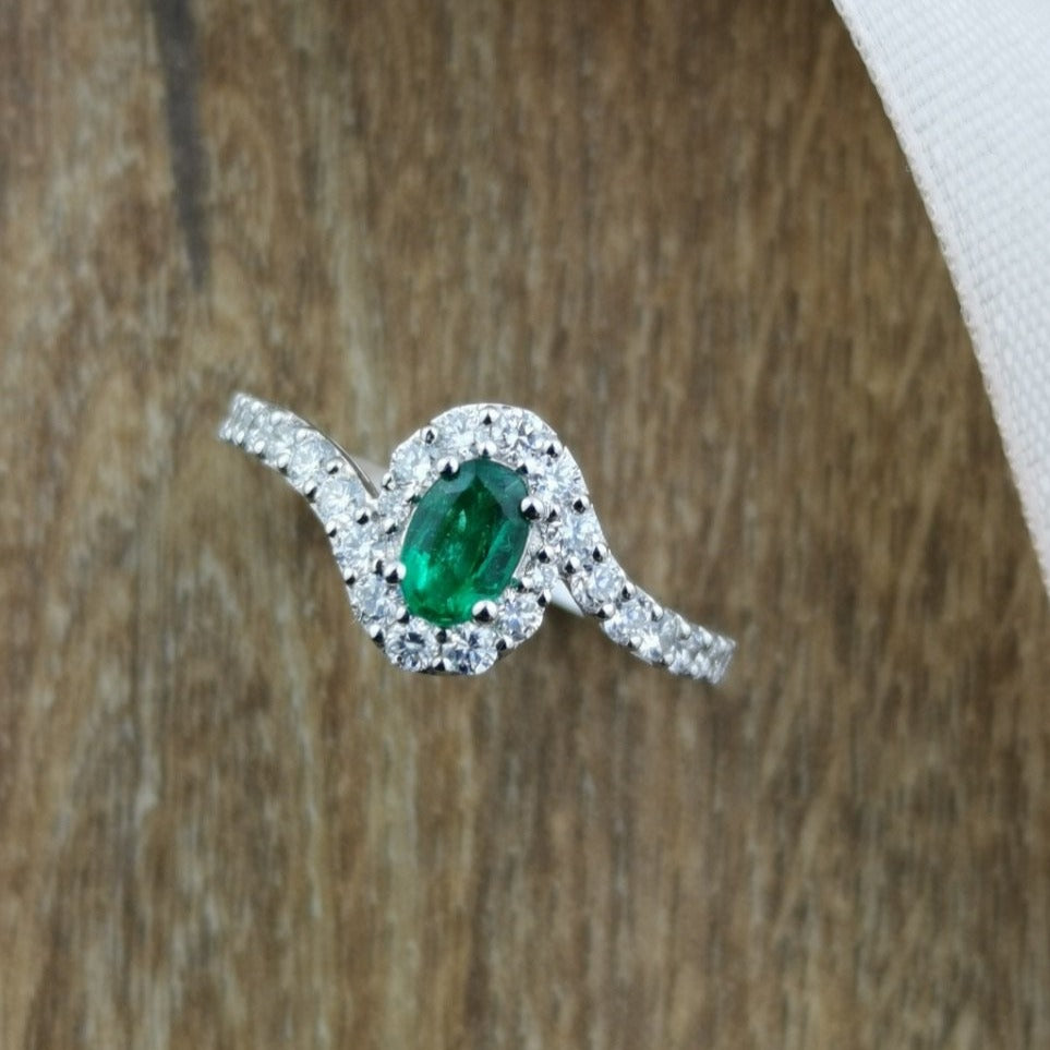 Oval emerald and diamond halo twist ring