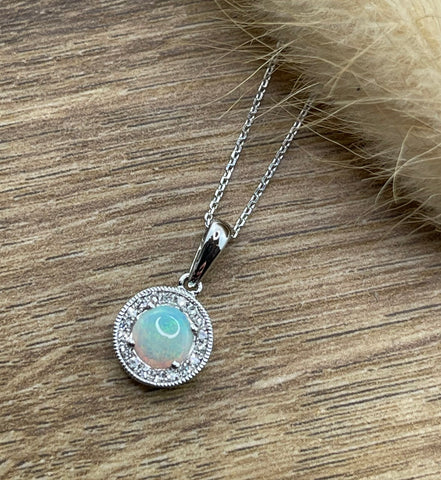 Round opal and diamond halo pendant