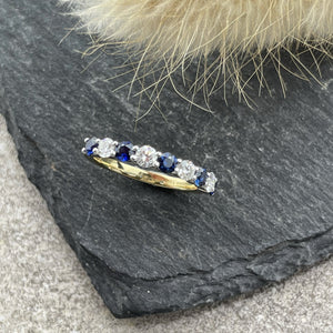 Sapphire and diamond seven stone eternity ring