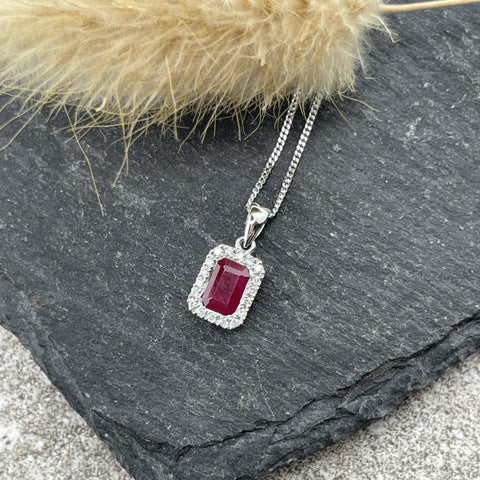 Ruby and diamond halo pendant