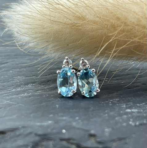 Oval blue topaz and diamond earrings