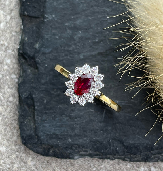 Oval ruby and diamond cluster ring