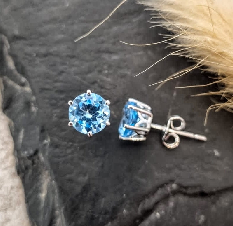 Round blue topaz stud earrings