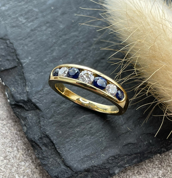 Sapphire and diamond channel eternity ring