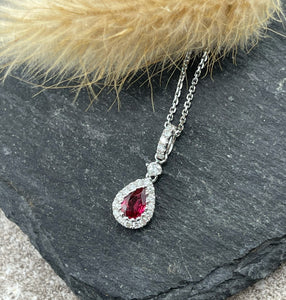 Ruby and diamond pear shaped halo pendant