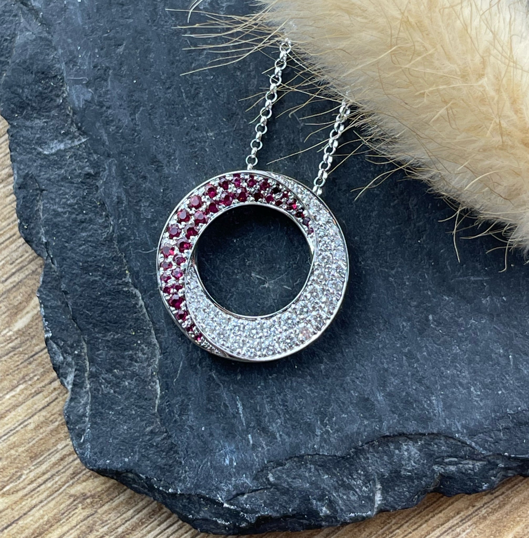 Ruby and diamond swirl circle pendant
