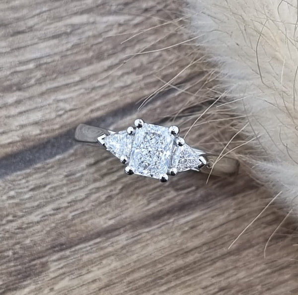 Radiant and trillion cut diamond ring