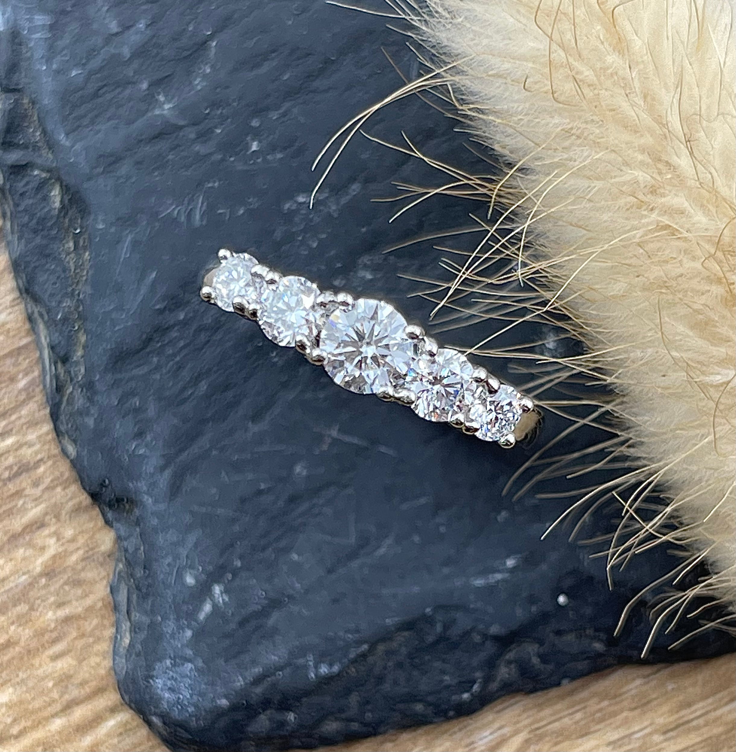 High set five stone diamond eternity ring