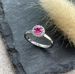 Round pink sapphire halo ring