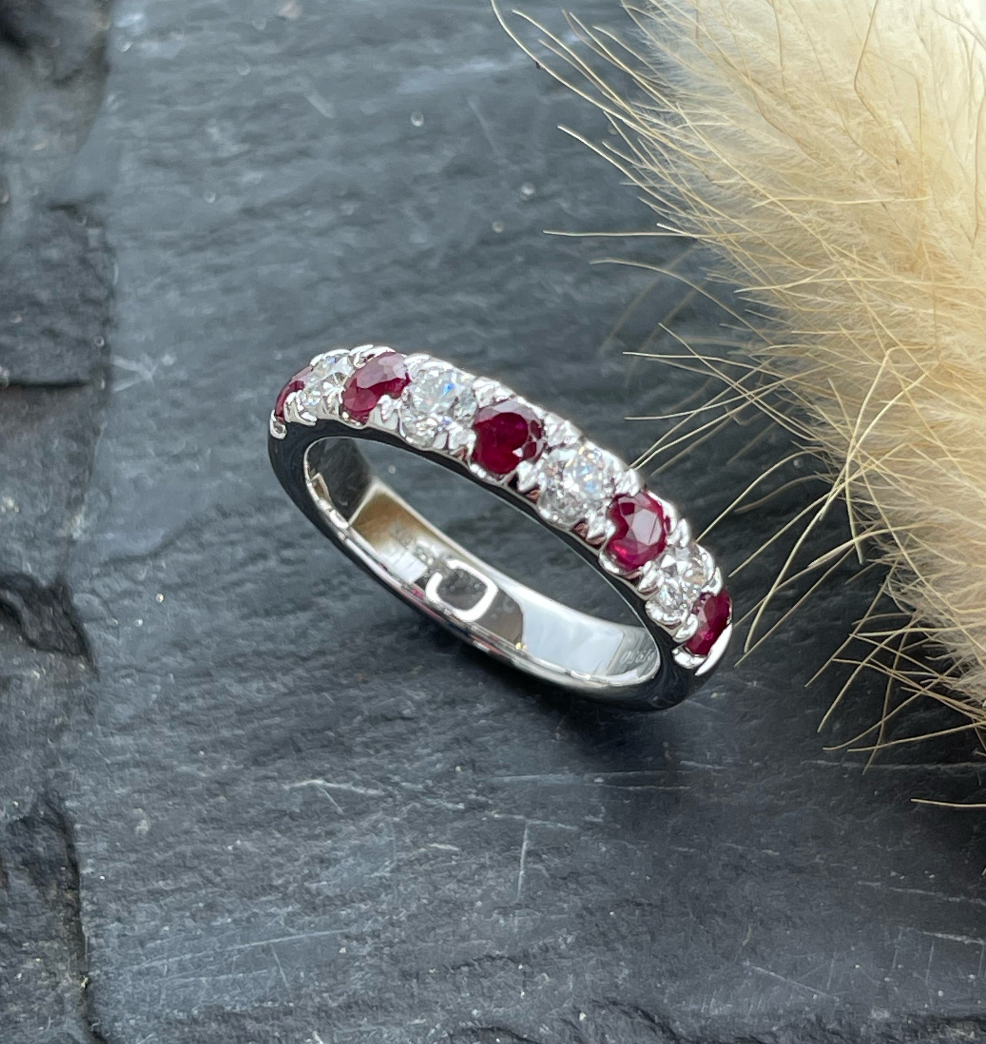 Ruby and diamond claw set eternity ring