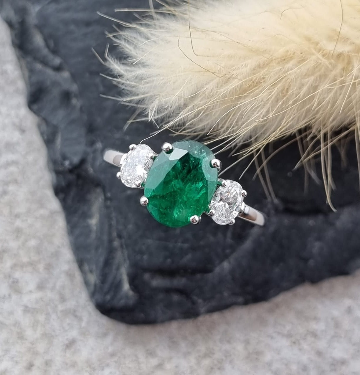 Large oval emerald and diamond trilogy ring