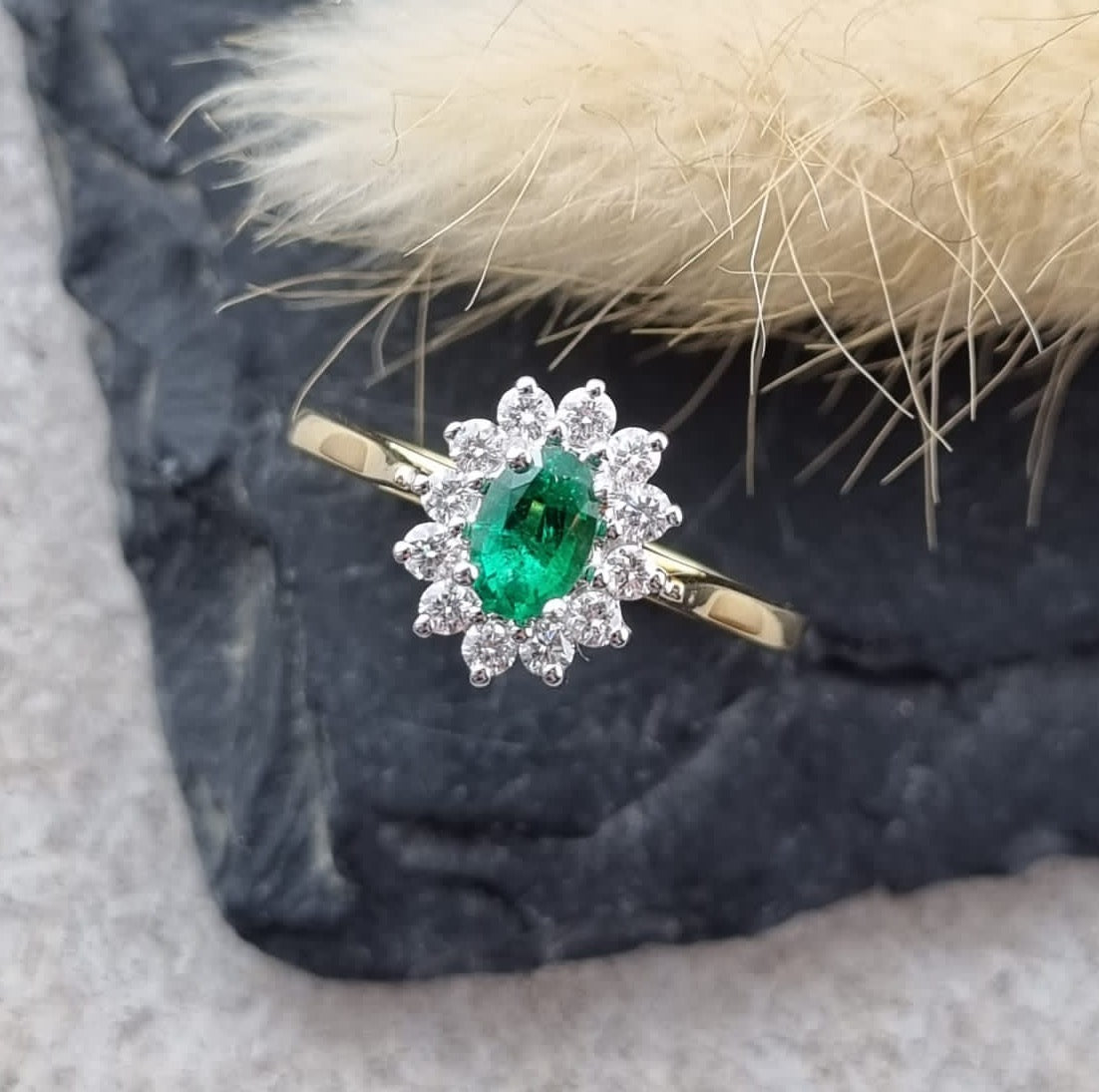 Oval emerald cluster ring