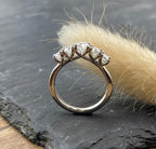 High set five stone diamond eternity ring