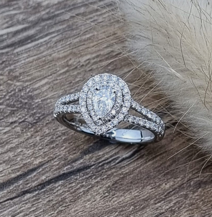 Pear cut diamond double halo ring