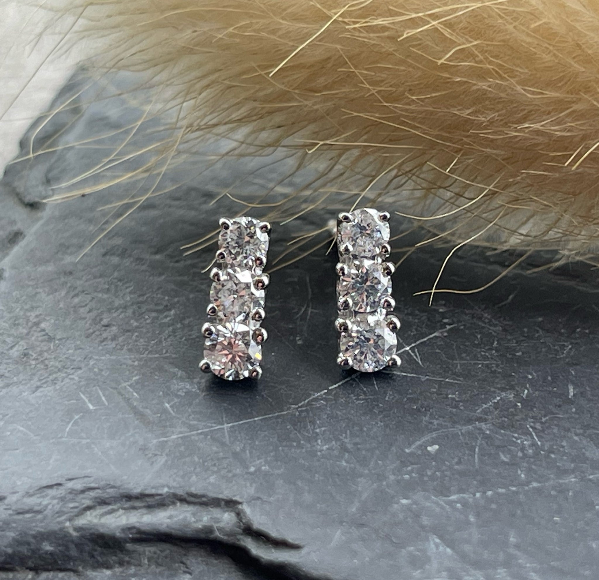 Three stone diamond stud earrings