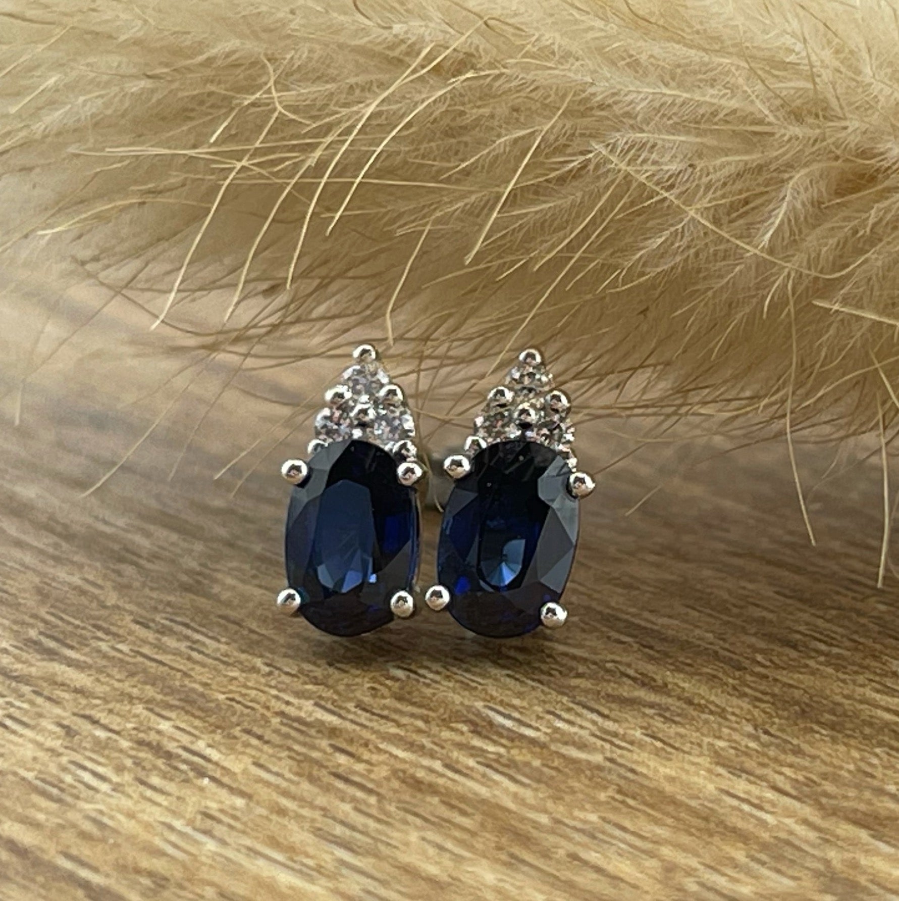 Oval sapphire claw set stud earrings