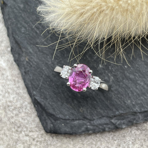 Oval pink sapphire trilogy ring