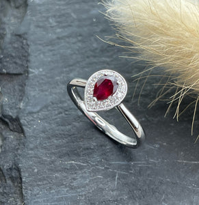 Pear cut ruby halo ring