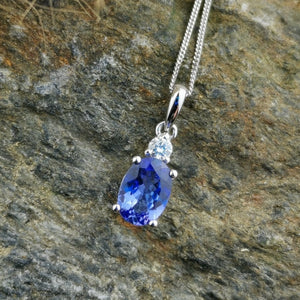 Oval tanzanite and diamond pendant