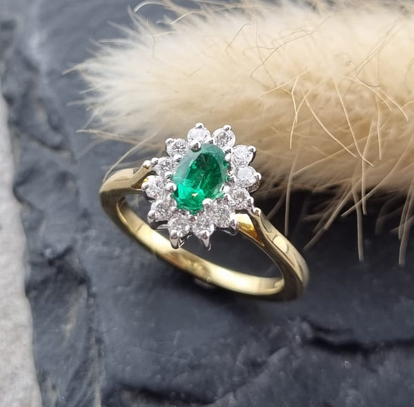 Oval emerald cluster ring