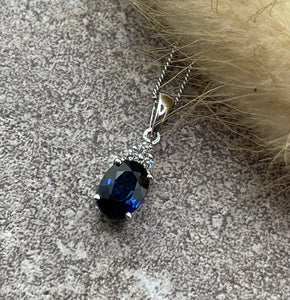 Oval sapphire and diamond pendant
