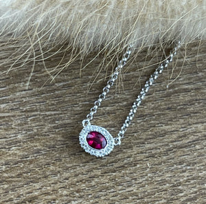 Oval halo ruby pendant