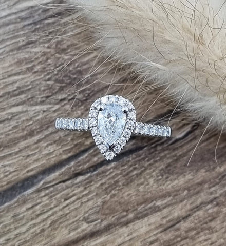 Pear cut diamond halo ring