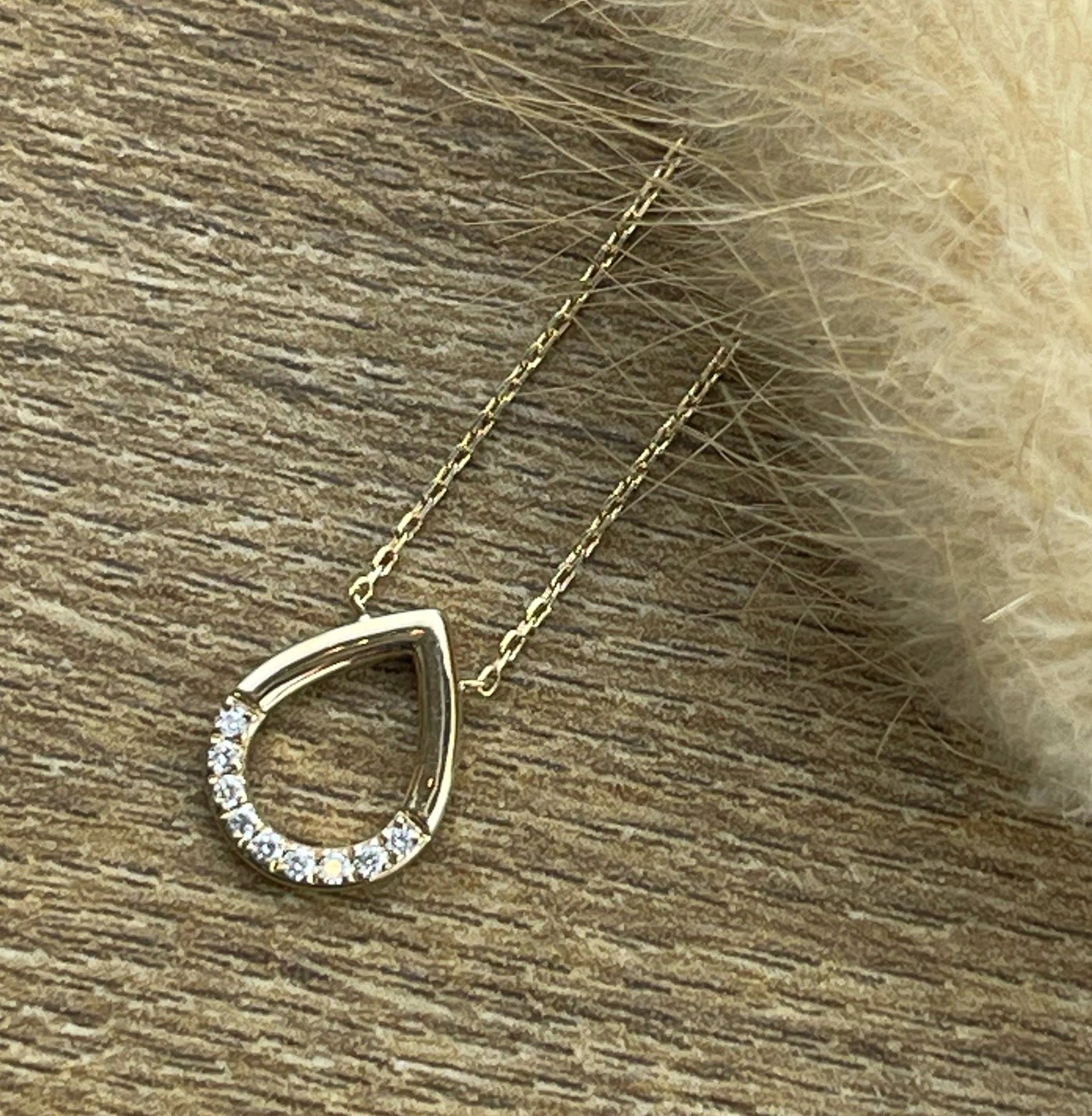 Open teardrop diamond pendant