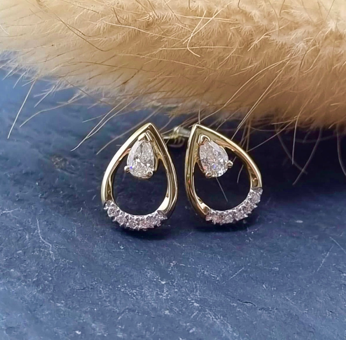 Open pear cut diamond earrings