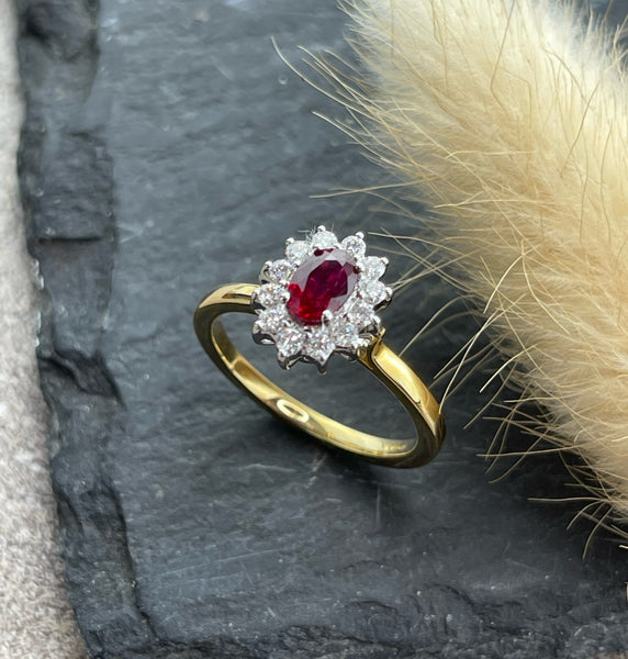 Oval ruby and diamond cluster ring