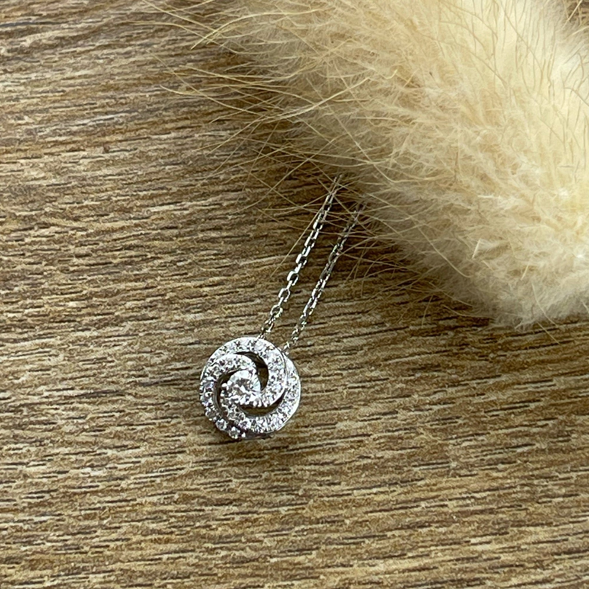 Spiral diamond pendant