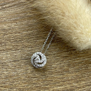 Spiral diamond pendant