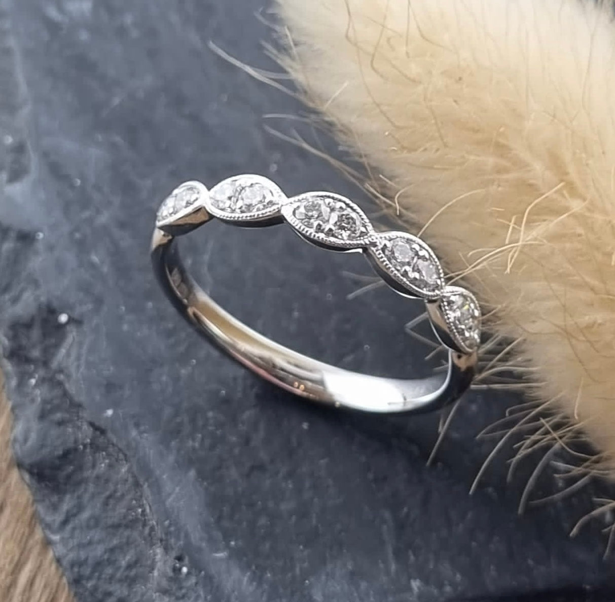 Scalloped pave set diamond band