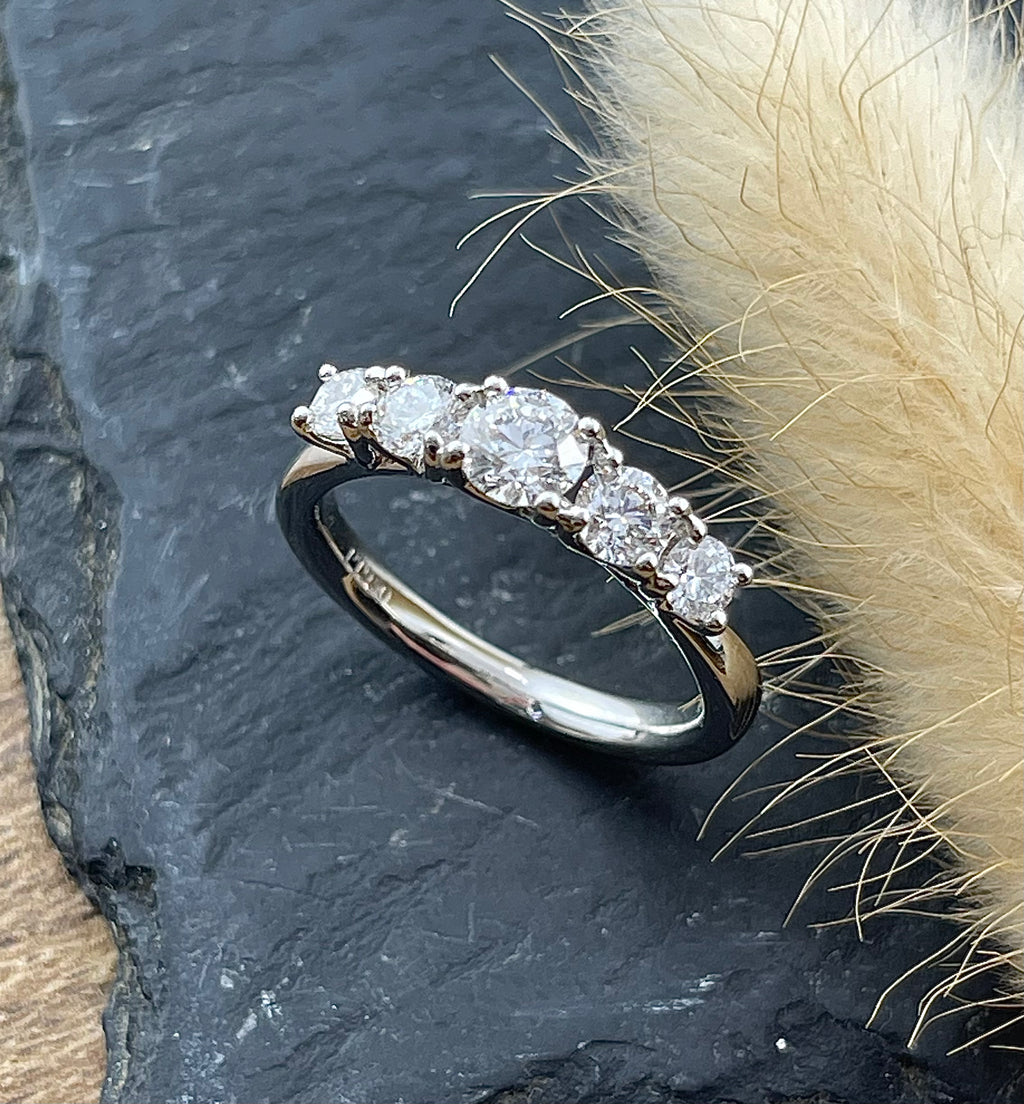 High set five stone diamond eternity ring