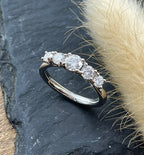 High set five stone diamond eternity ring