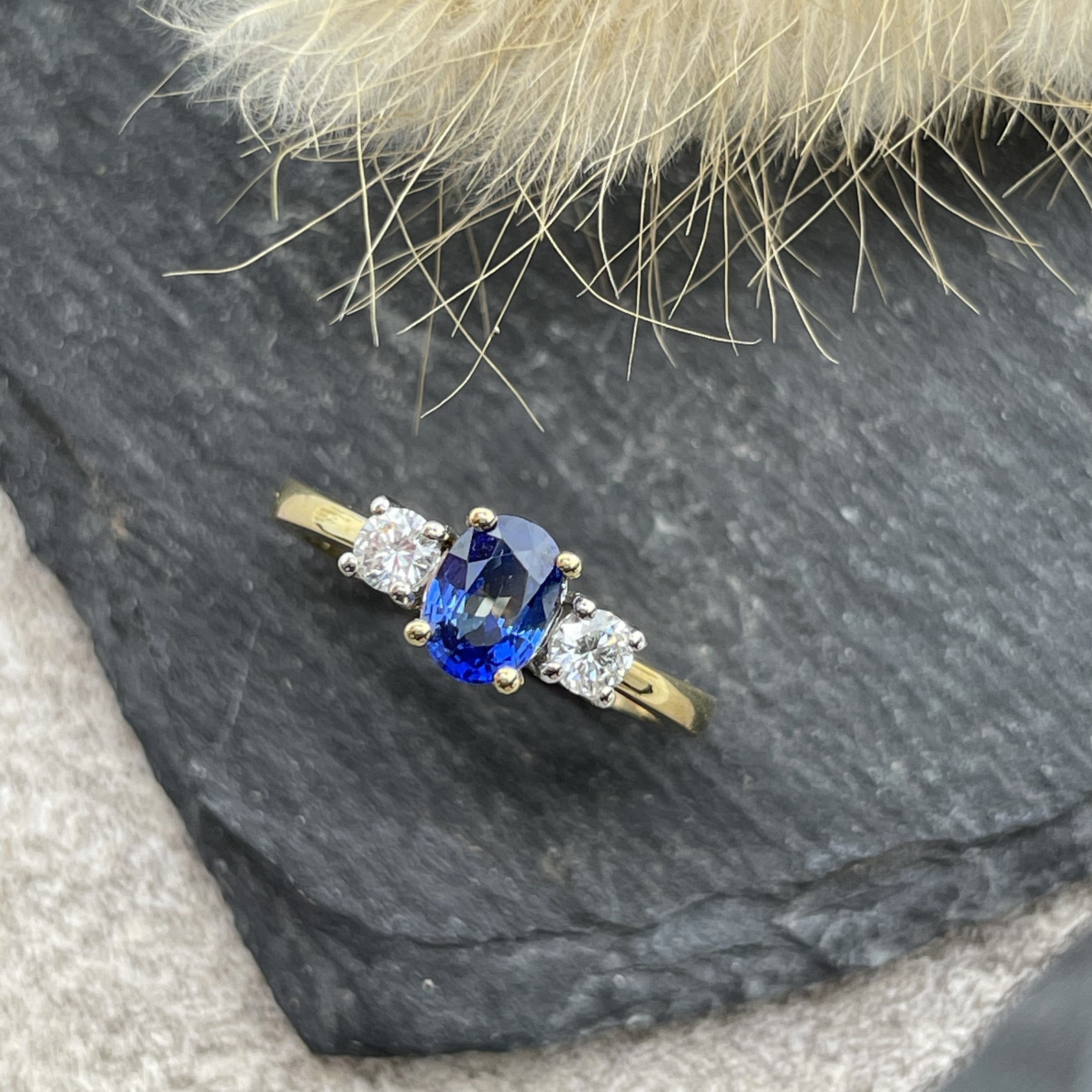 Oval sapphire and diamond trilogy ring